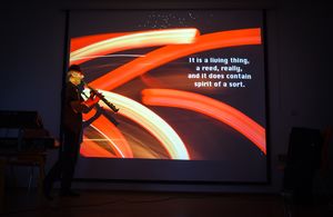 <!--LINK'" 0:679--> during his multimedia act, merging photography, poetry and solo saxophone at <!--LINK'" 0:680-->, 2014