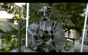 A still frame from <!--LINK'" 0:12--> promo video featuring a bust of <!--LINK'" 0:13-->, the leading Slovene Impressionist painter and patron of arts. A public sculpture created by <!--LINK'" 0:14--> in 1969 is located in front of the <!--LINK'" 0:15-->. Shot in 2013.