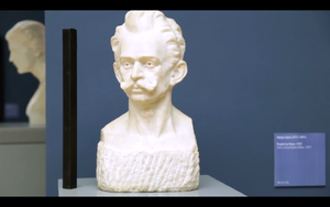 A still frame from <!--LINK'" 0:25--> promo video featuring a marble bust of <!--LINK'" 0:26--> (1876&ndash;1918), the beginner of Modernism in Slovene literature, sculpted by <!--LINK'" 0:27-->, shot in <!--LINK'" 0:28-->, 2013.